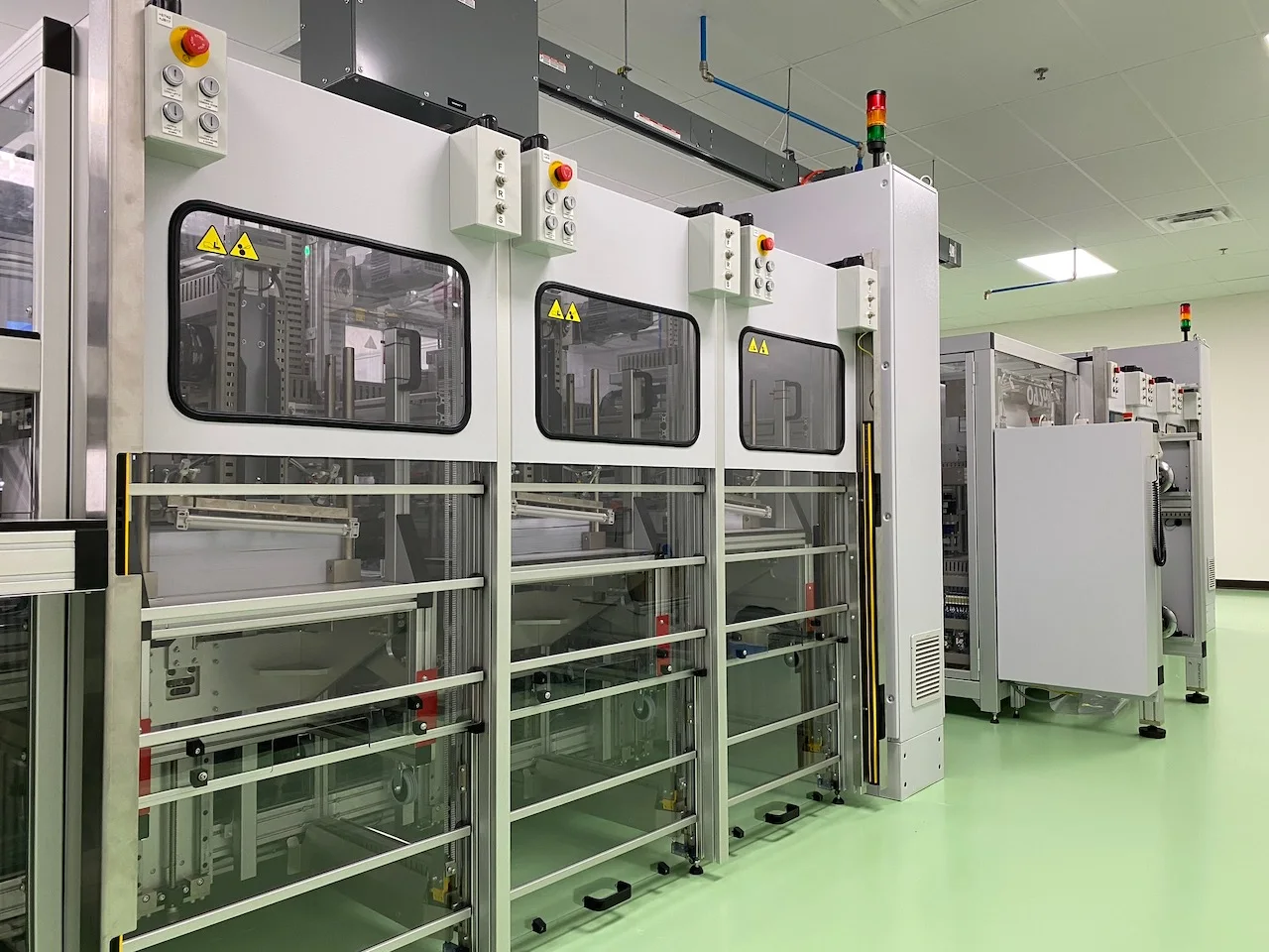 Automated multi-station collating line aligning smart card material layers