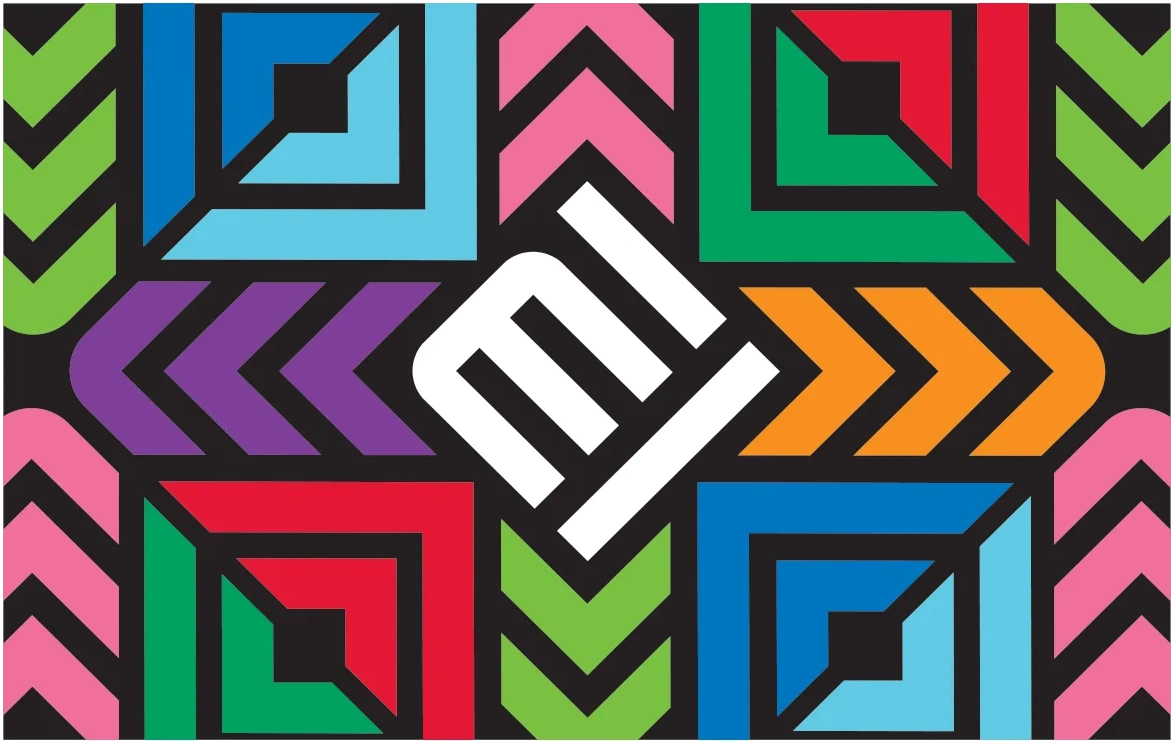 Transit card with a bold multicoloured geometric chevron pattern